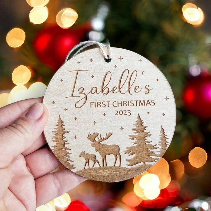 Personalised Round Wooden Ornament - Babys First Christmas Bauble with Winter Moose Christmas Forest Design