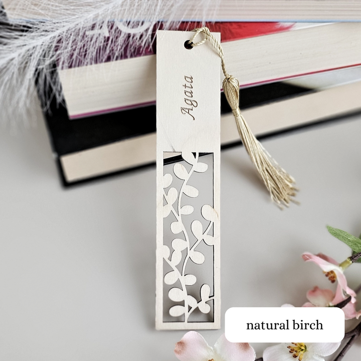 a bookmark with a tassel hanging from it