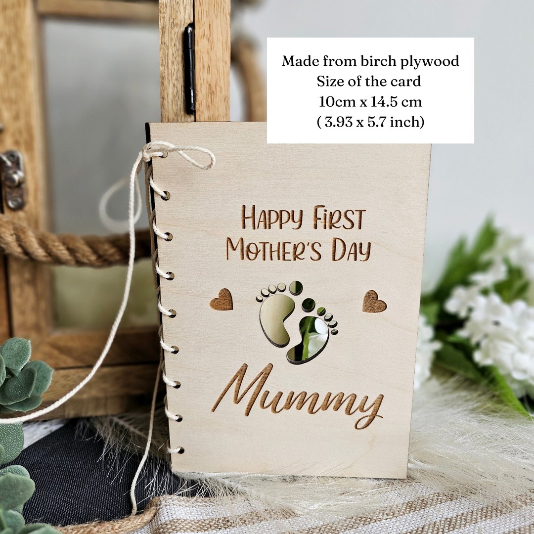 A handmade wooden card with the text "Happy First Mother's Day Mummy" printed on it, along with a small footprint image. The card is made from birch plywood and has a size of 10cm x 14.5cm (3.93 x 5.7inch).