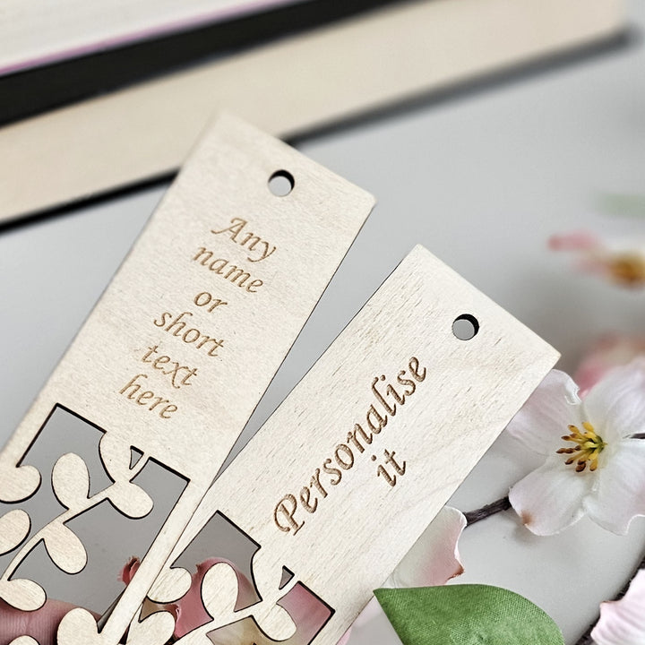 a couple of wooden tags sitting on top of a table