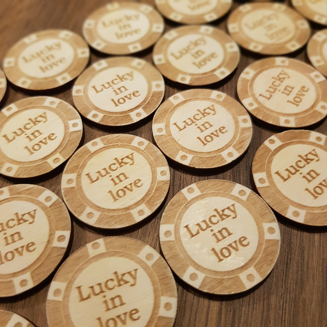 a pile of wooden poker chips sitting on top of a table