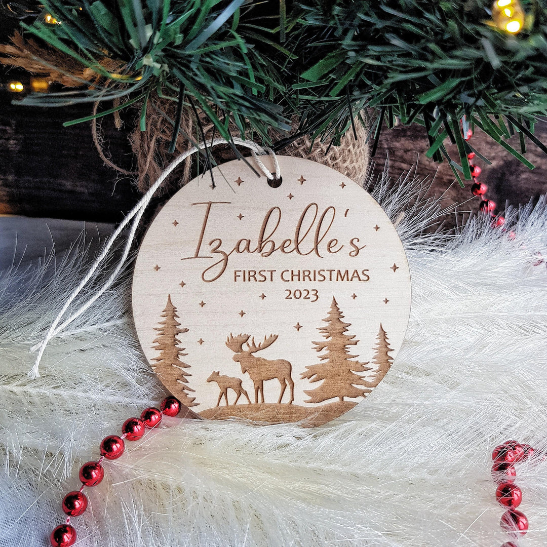 Personalised Round Wooden Ornament - Babys First Christmas Bauble with Winter Moose Christmas Forest Design