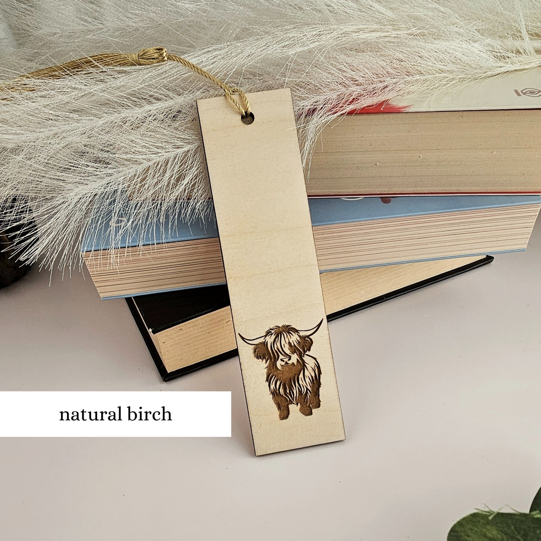 a wooden bookmark with a picture of a dog on it