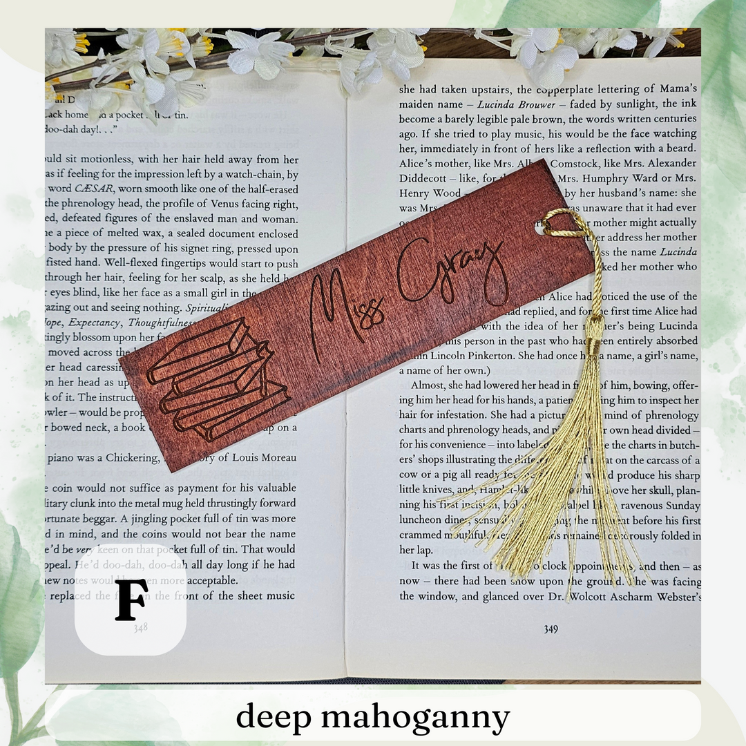 an open book with a bookmark and a tassel