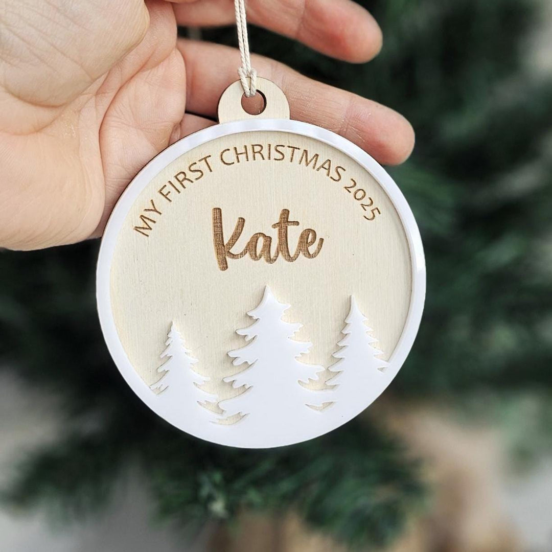 Laser-cut wood and white acrylic Christmas tree design keepsake decoration.