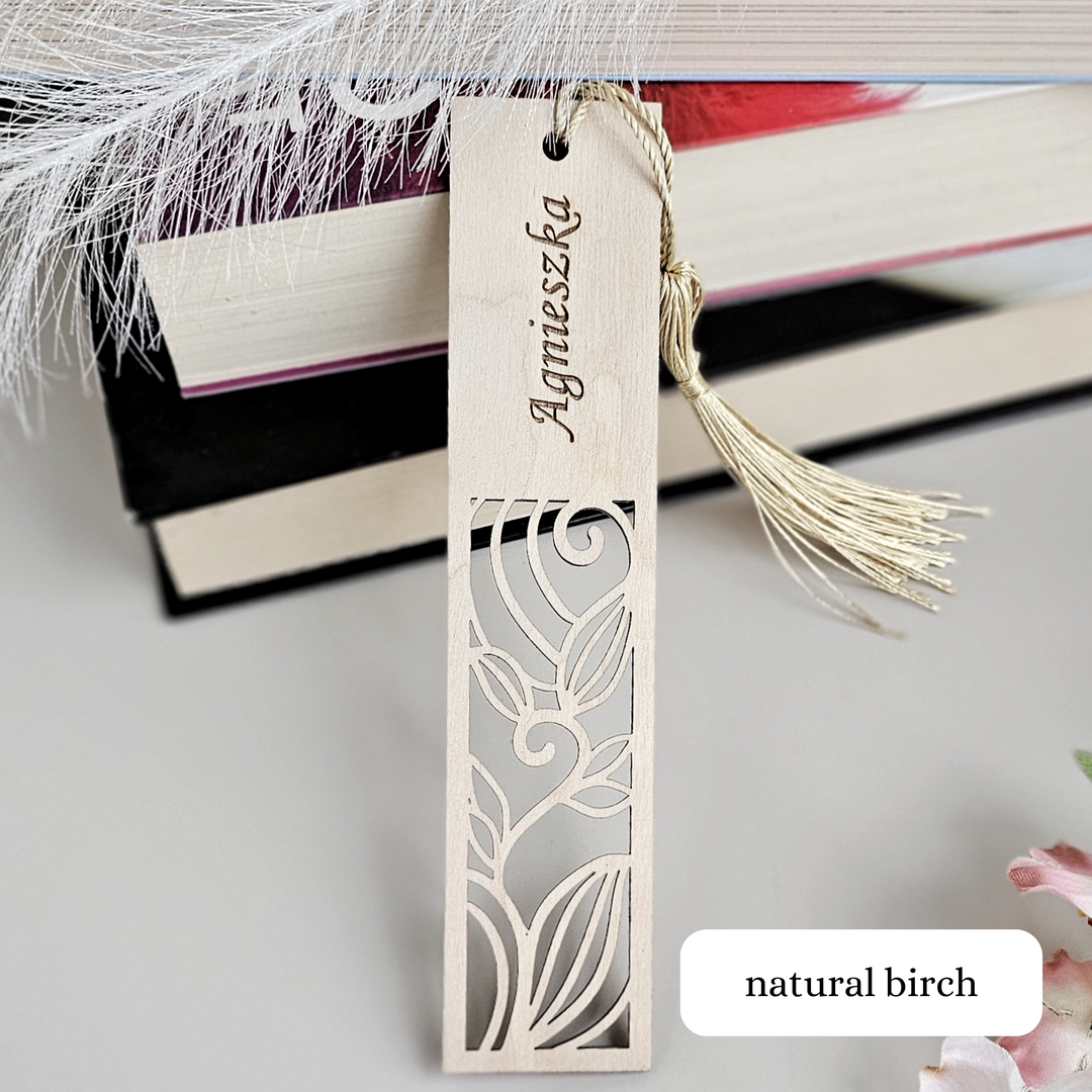 a bookmark with a tassel hanging from it