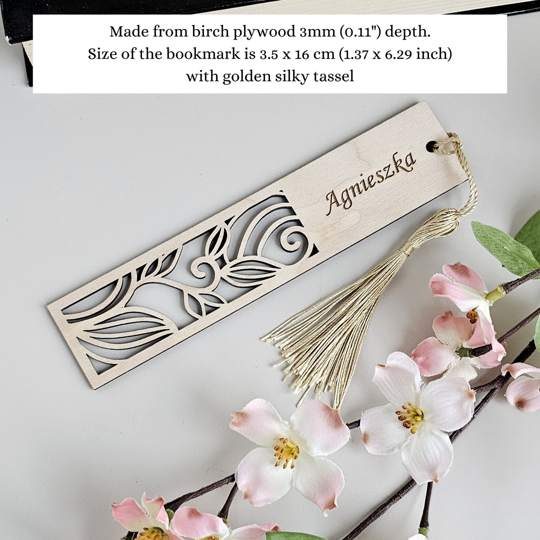 a bookmark with a tassel and flowers on it