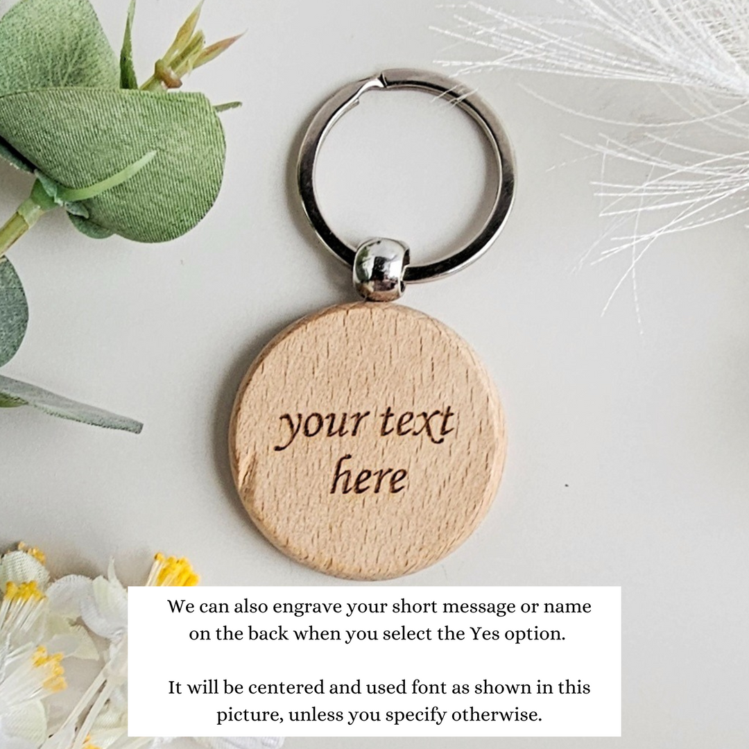 a wooden keychain with a message on it