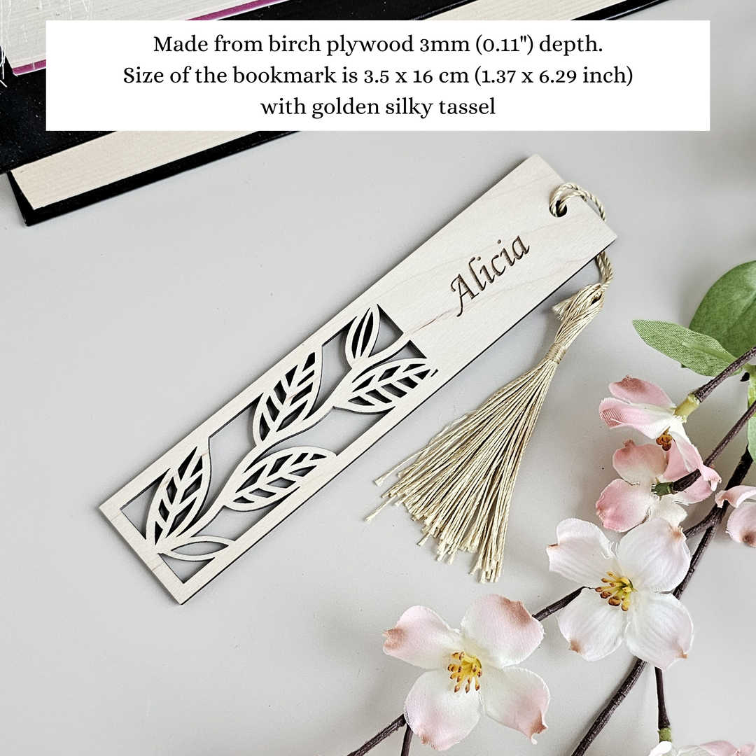 a bookmark with a tassel and flowers on it