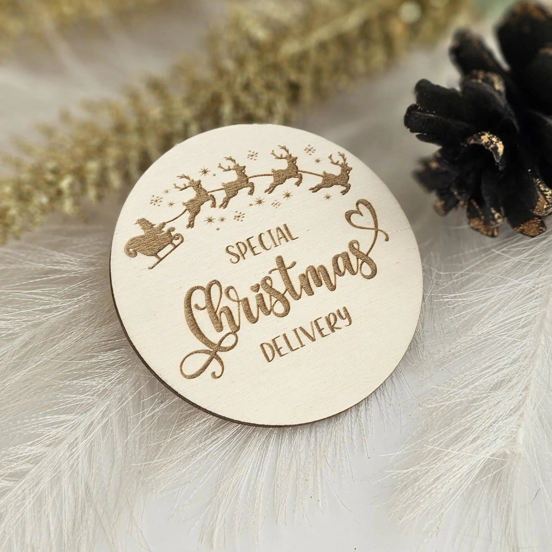 A round wooden sign with the text "SPECIAL CHRISTMAS DELIVERY" engraved on it, surrounded by decorative elements such as reindeer silhouettes and pine cones.