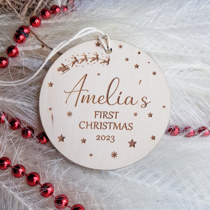 a personalized wooden ornament for a baby's first christmas