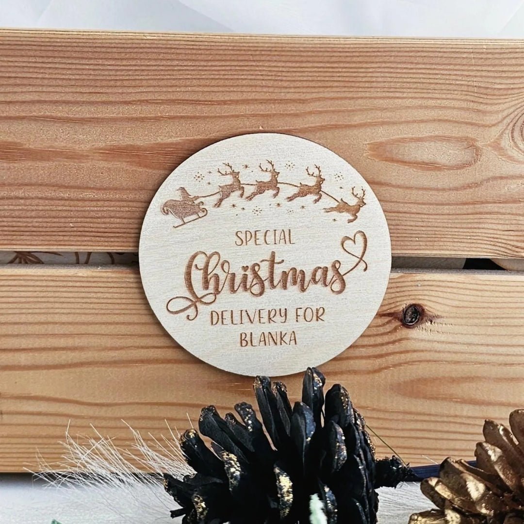 A wooden coaster with a Christmas-themed design, featuring a Santa Claus sleigh and reindeer, and the text "Special Christmas Delivery for Blanka".