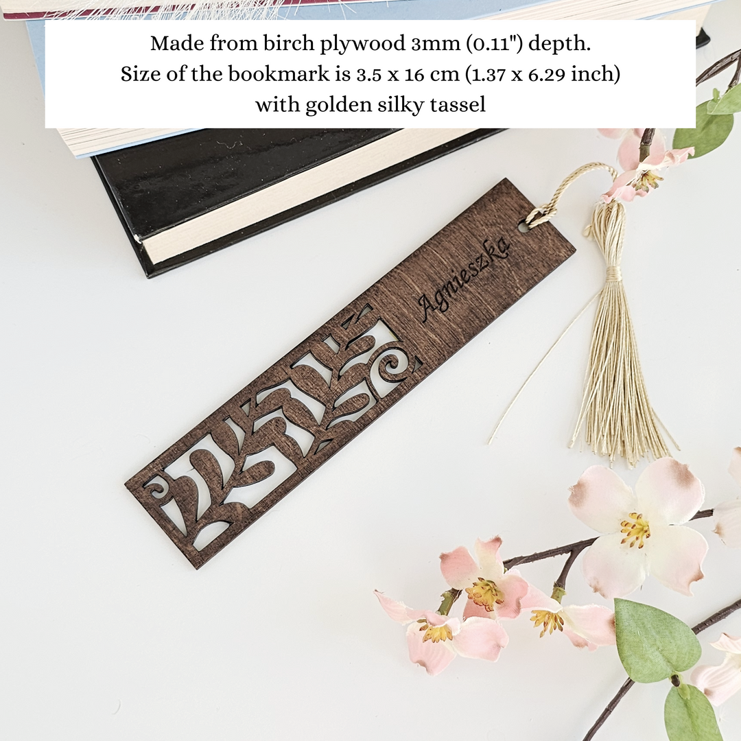 a bookmark with a name and a tassel hanging from it