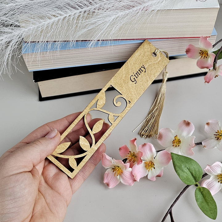 a person holding a bookmark with the word grace on it