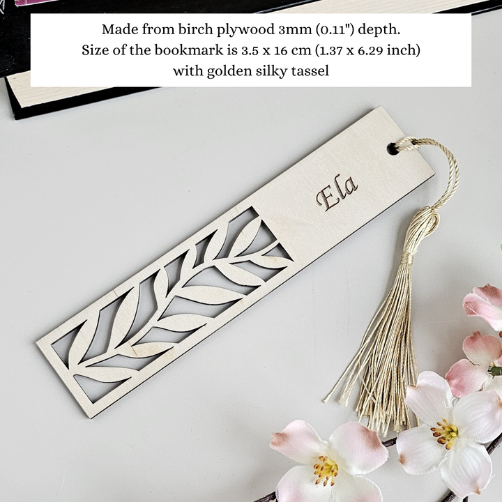 a bookmark with a tassel hanging from it