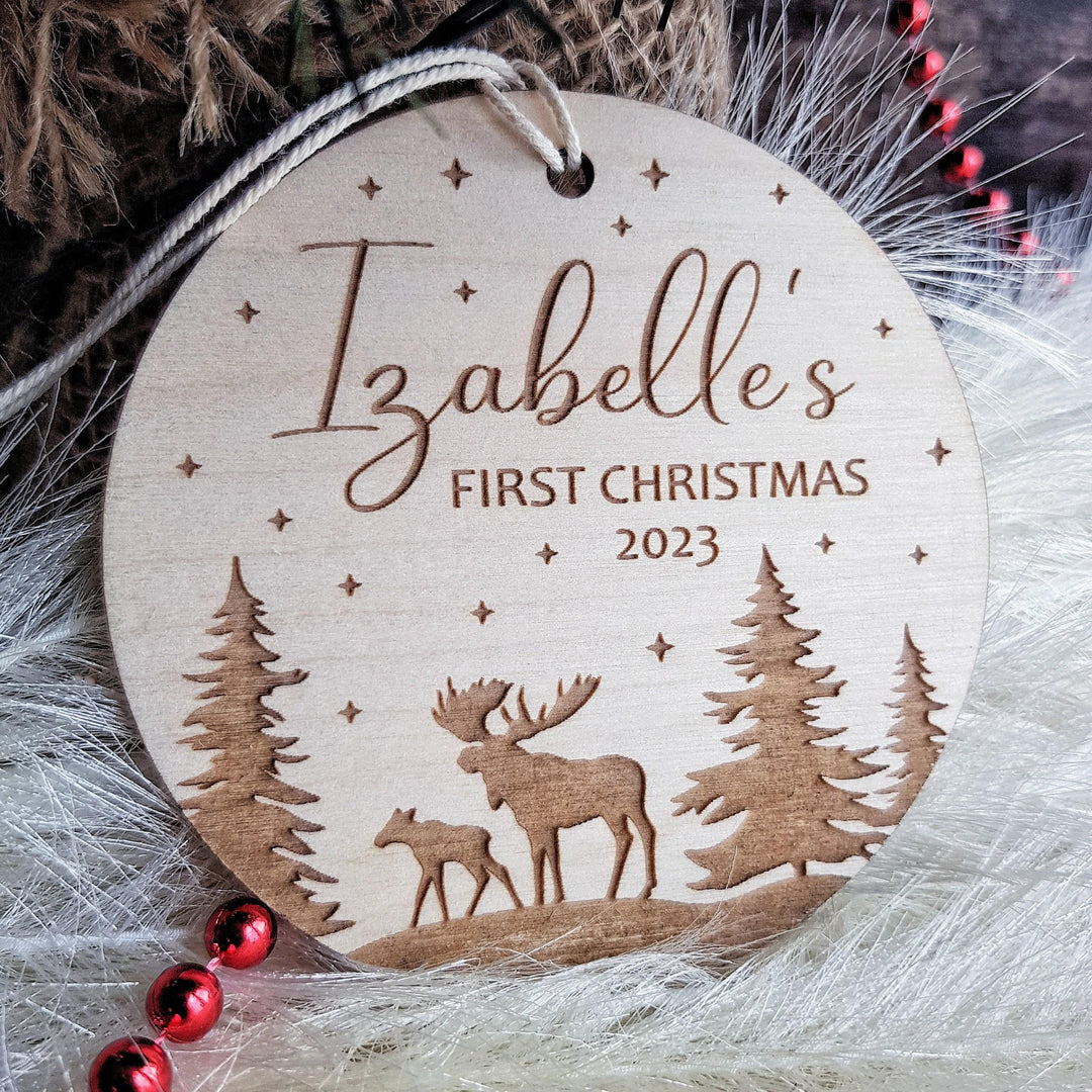 Personalised Round Wooden Ornament - Babys First Christmas Bauble with Winter Moose Christmas Forest Design