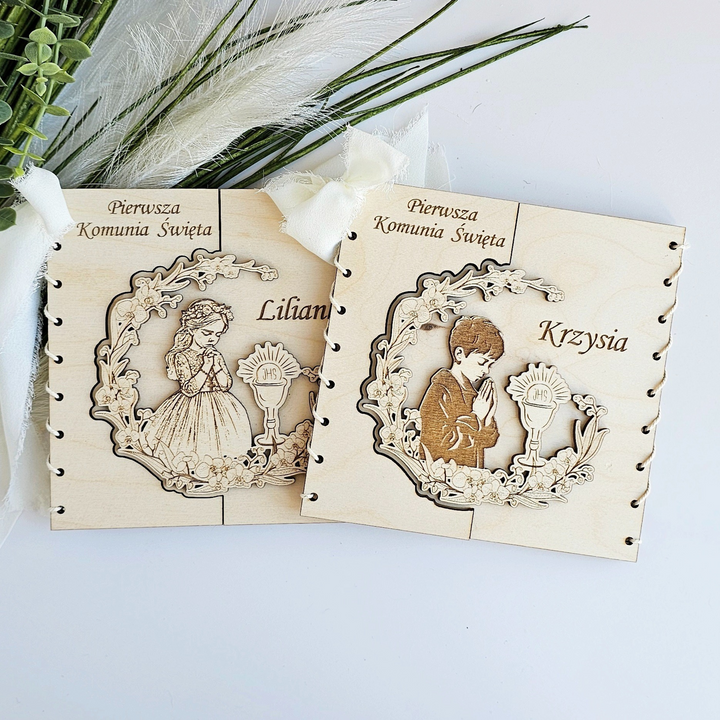 two wooden greeting cards with illustrations of a girl and a boy, along with the names "Lily" and "Krysyia" printed on them.
