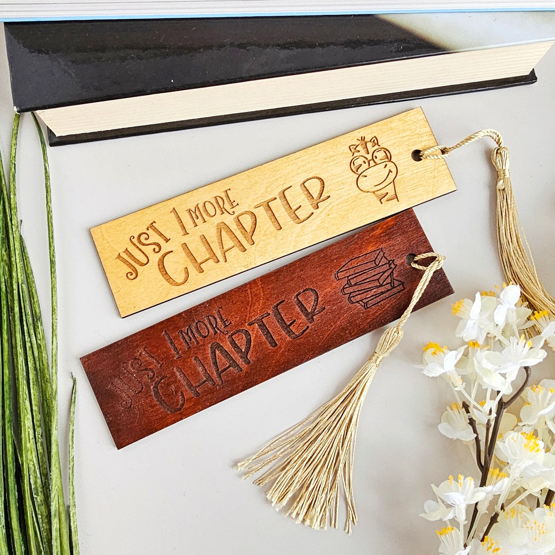 a couple of wooden signs sitting on top of a table