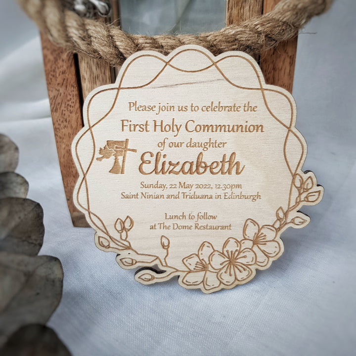 The image is a wooden sign with text and a decorative design, inviting people to a First Holy Communion celebration for Elizabeth.