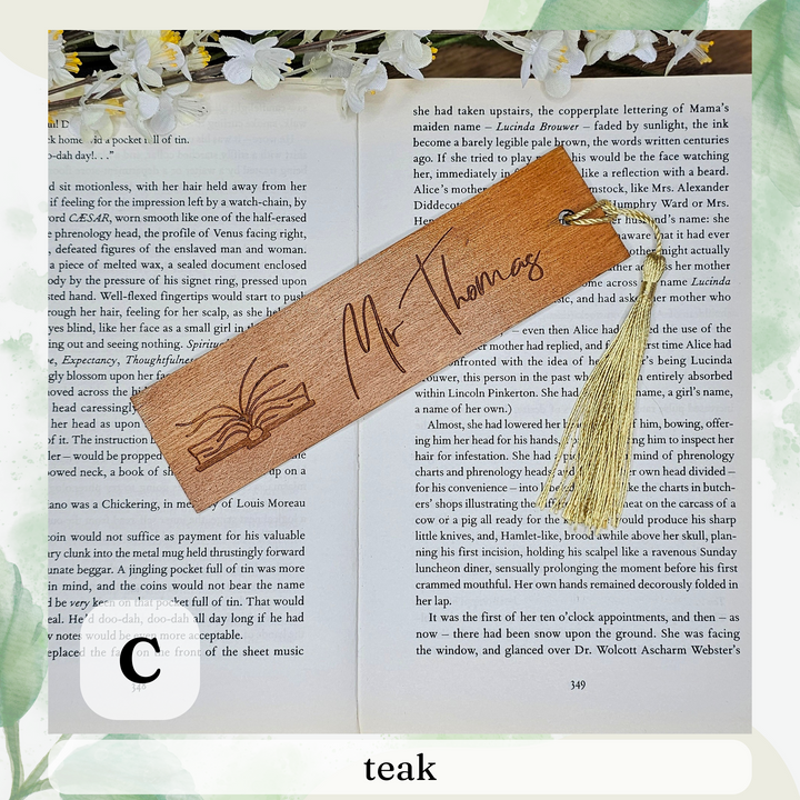 an open book with a tassel and a bookmark