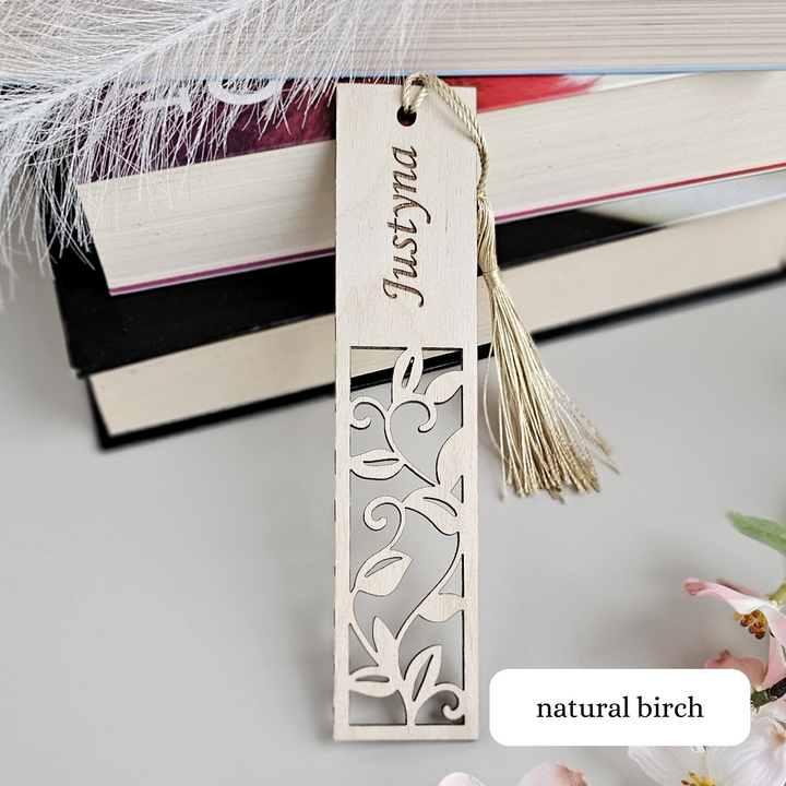 a bookmark with a tassel hanging from it