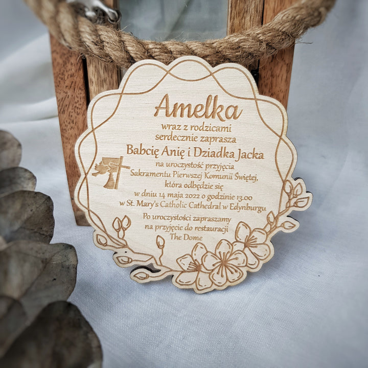 a wooden plaque with text and a floral design.